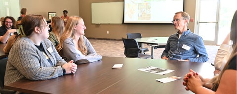 Paul Heidebrecht talks to a group of students during an information session.