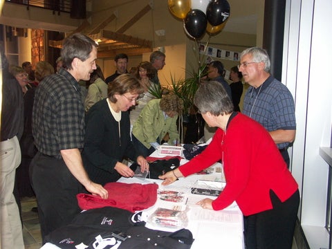 reunion guests gather at a table