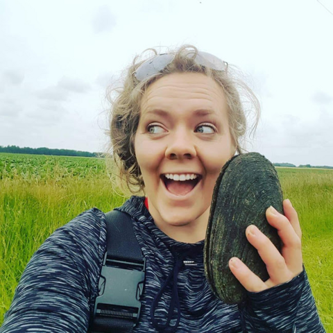 rebecca osborne holding a clam shell