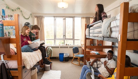 5 students in a bright residence room at Grebel