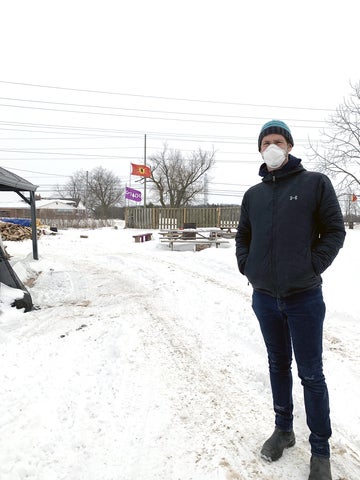 scott morton ninomiya standing on a snow covered path