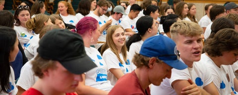 Students sitting in Grebel Great Hall on move in day