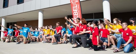 students welcome new grebel students outside in summer