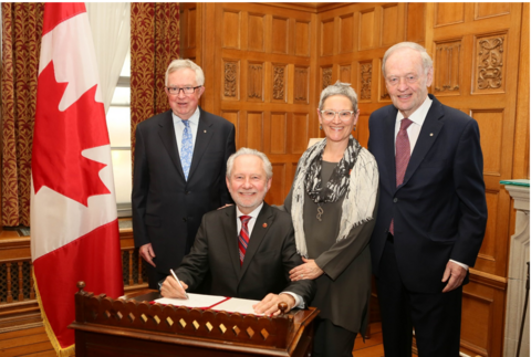 Harder being sworn in as senator with three others surronding him