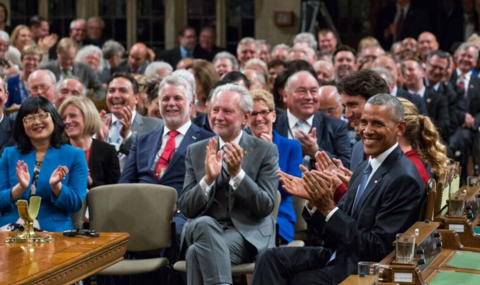 Harder among crowd sitting beside Obama and former Prime Minster Justin Trudeau