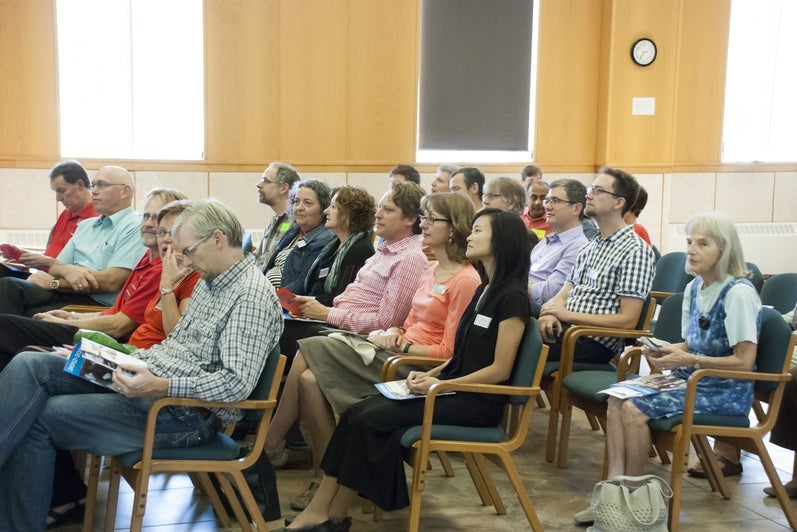 audience watching meeting