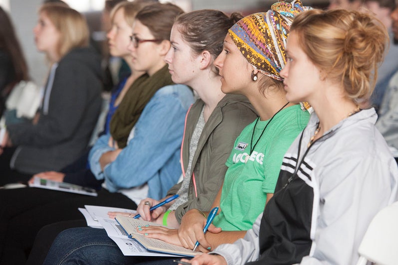 Students listening to a speaker