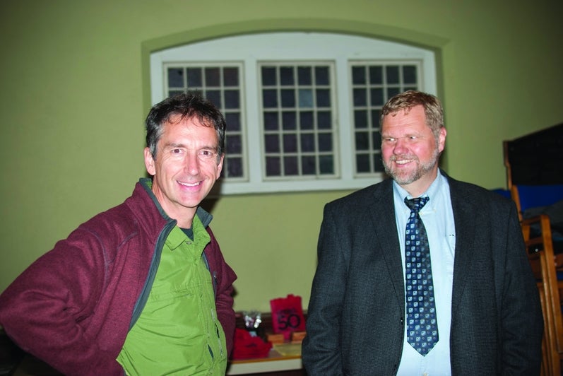 two men posing for photo