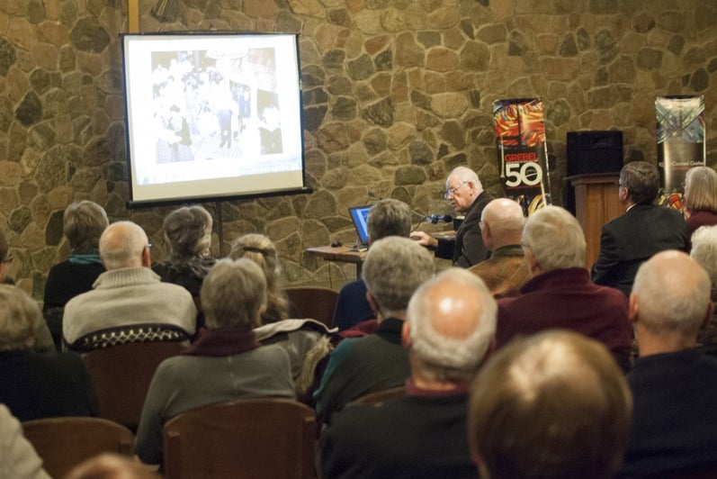 speaker at front of room