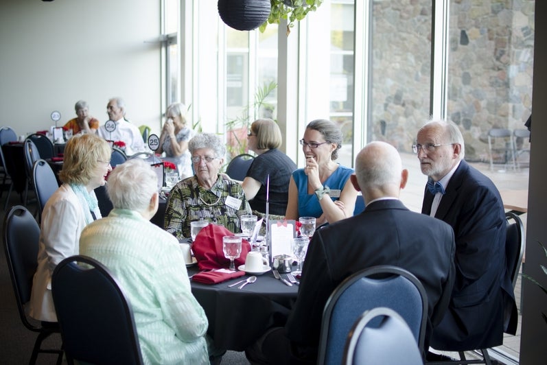 people sitting around tables
