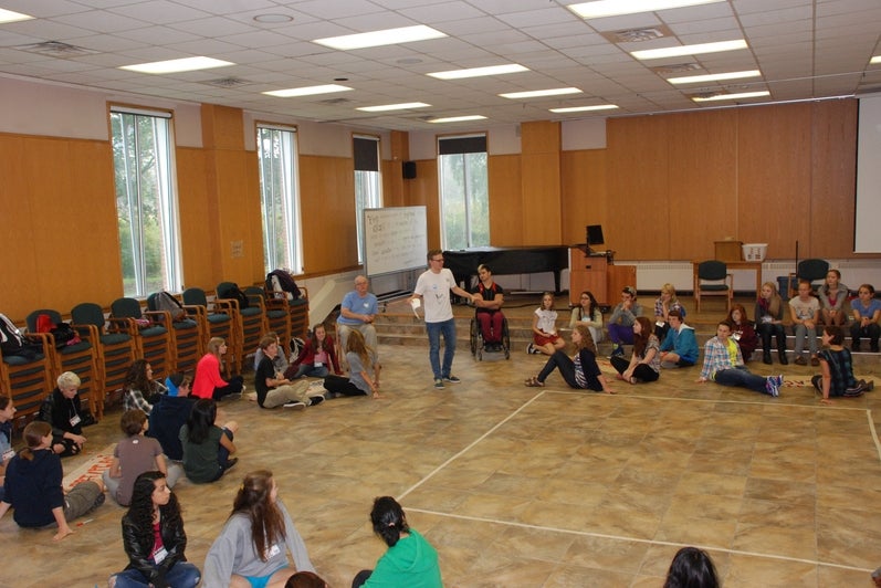 students listening to a speaker