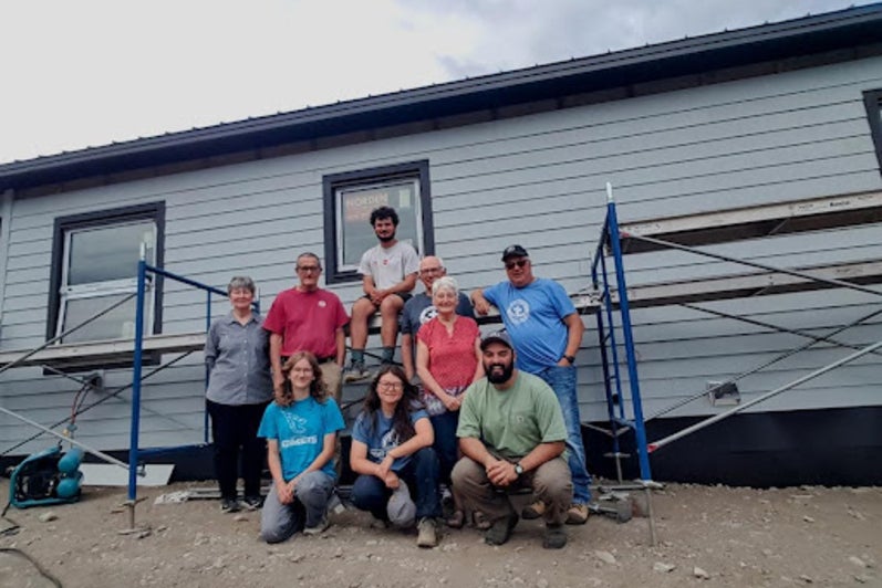 Isabel Song and the MDS crew outside a house in Lytton