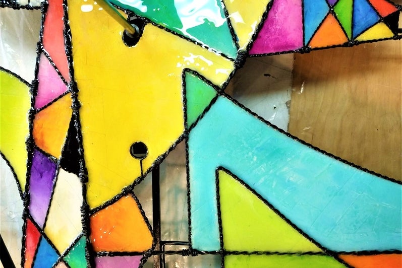 close up of the brightly coloured resin panels, various triangles