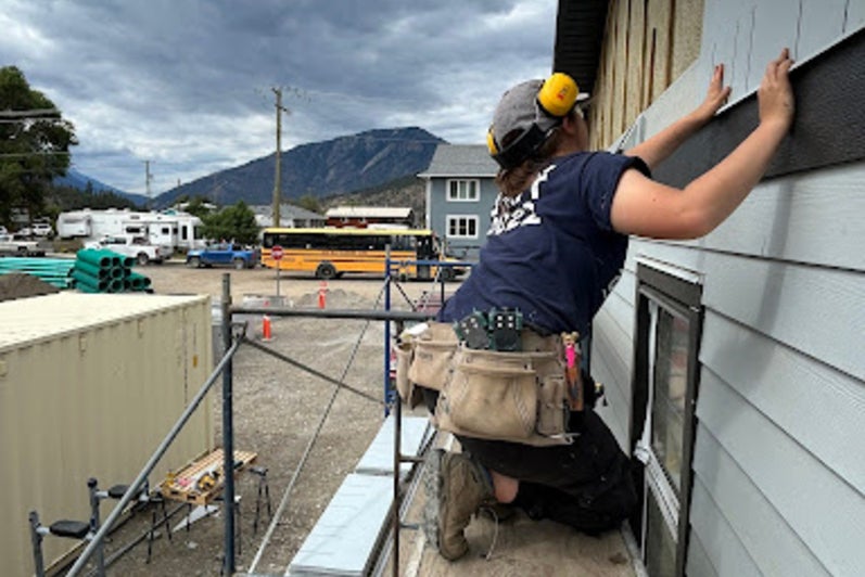 Isabel Song tiling a house at the construction site