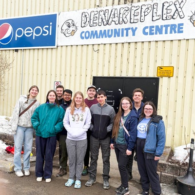 10 students standing in front of the Danareplex Community Centre