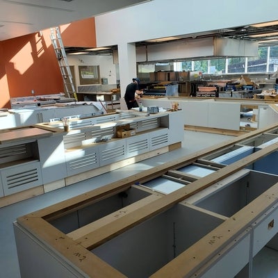 Cupboard structures begin being installed in the kitchen service area