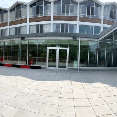 A panoramic view of the grebel patio and windows of the new dining room on a bright sunny day