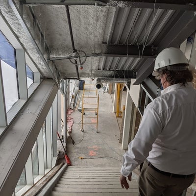 walking down the new stairway into the dining hall from the chapel foyer, still under construction