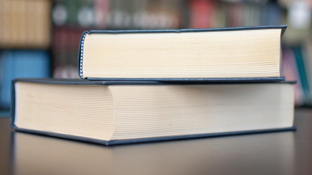 two books stacked on top of each other 
