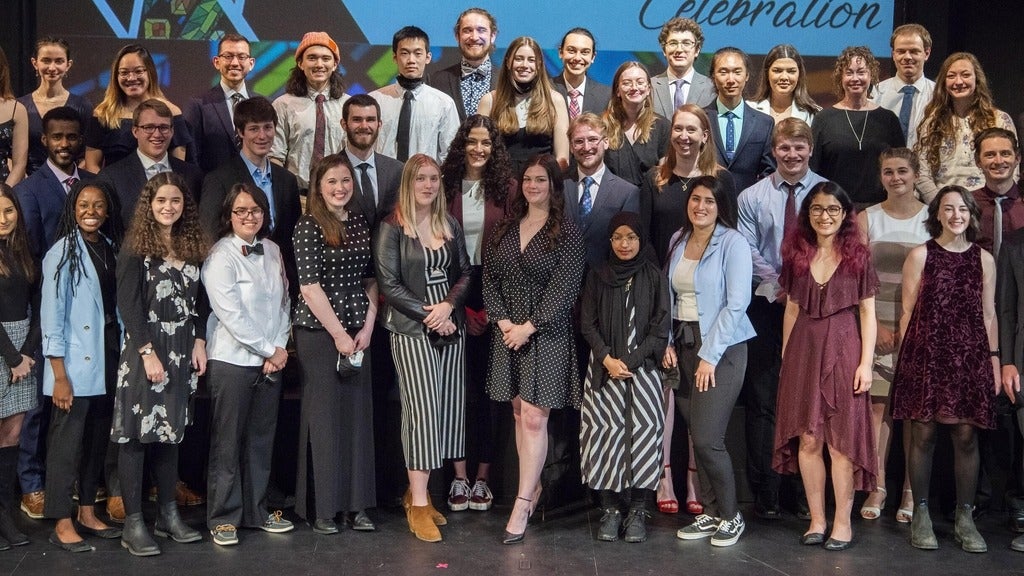 graduating class standing together 