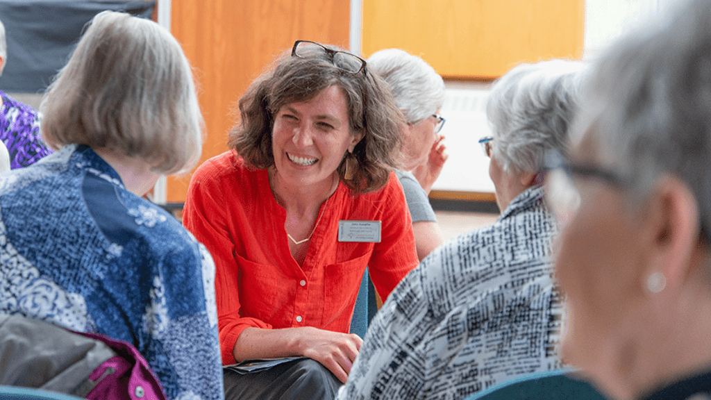 Jane talking to two women 