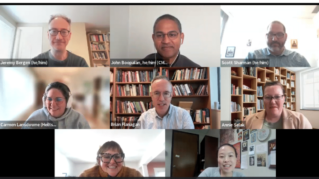 A Zoom screenshot with 8 participants smiling