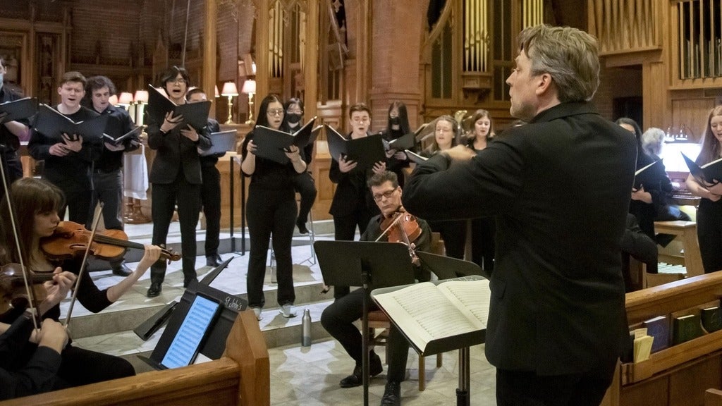 Mark Directing a choir and instruments 