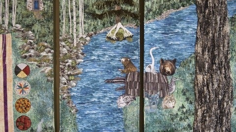 quilt of animals crossing a river 