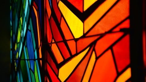 close up on orange and blue stained glass