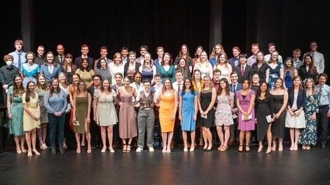 graduates from 2023 posing together