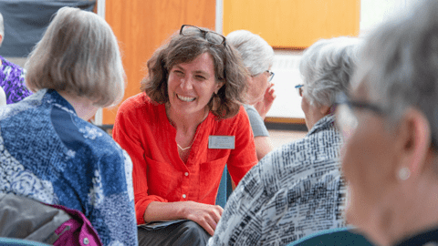 Jane talking to two women 
