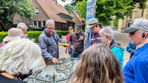 Troy Osborne on a tour with alumni and friends