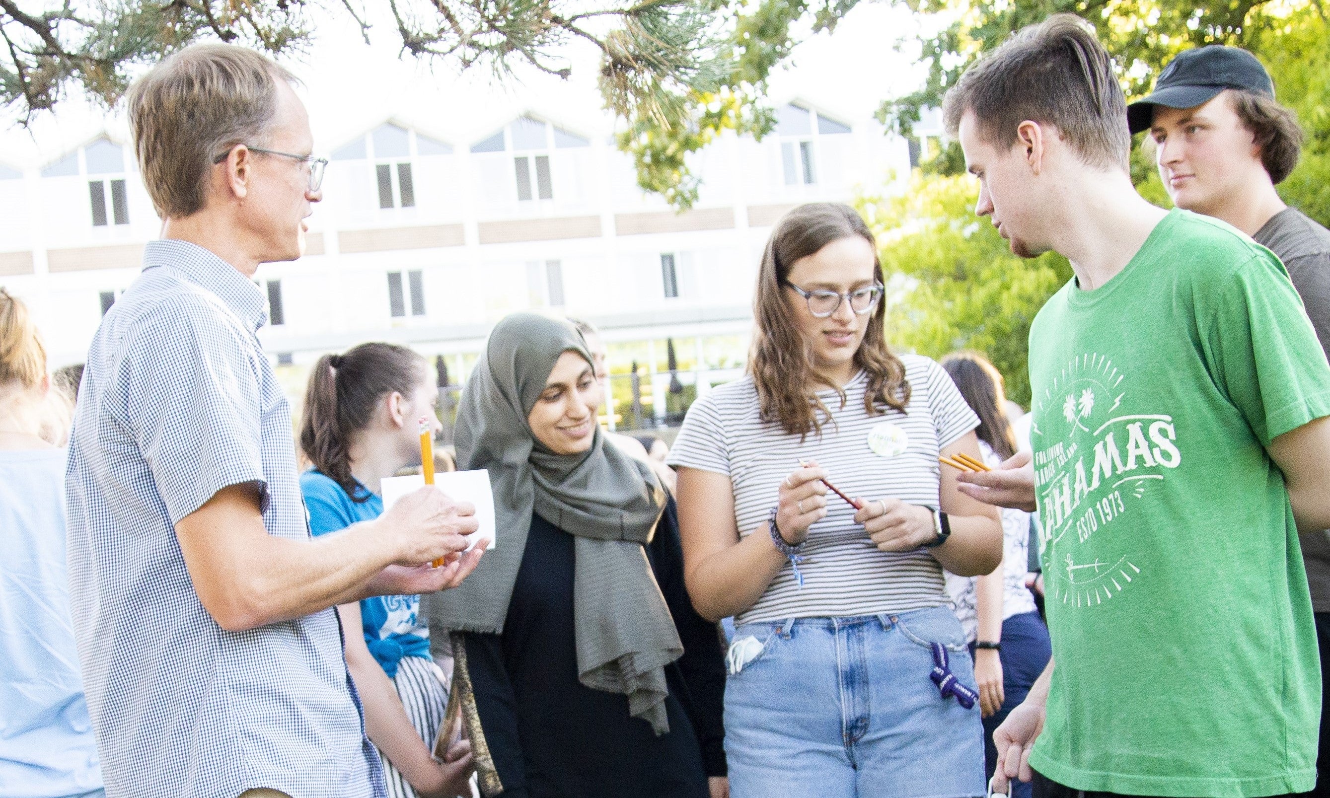 students standing and talking together outside