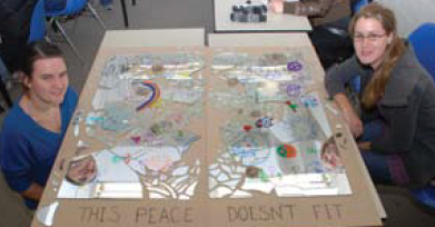 “This peace doesn’t fit” project with the 2 students who created it.