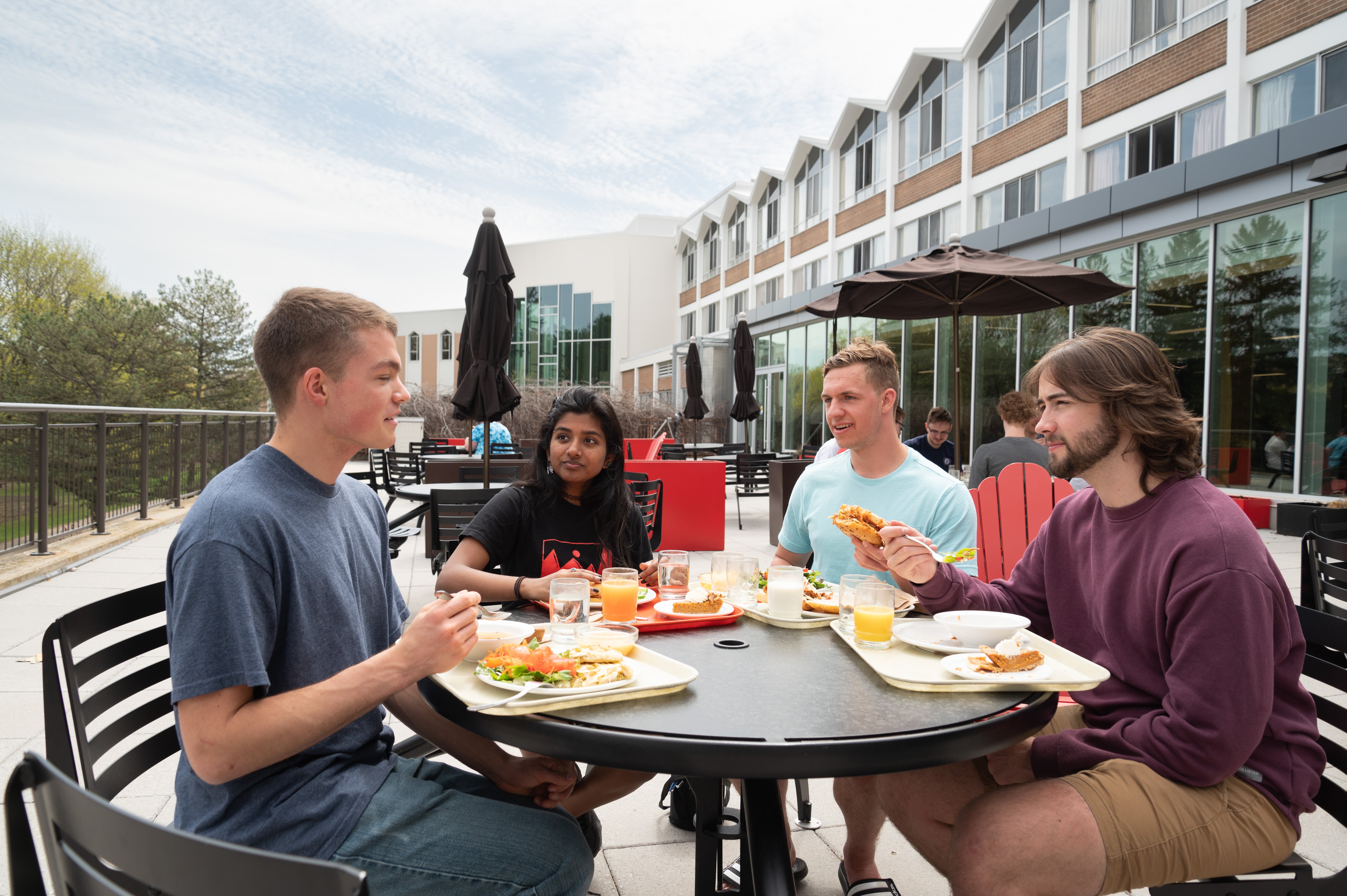 students eating on the patio