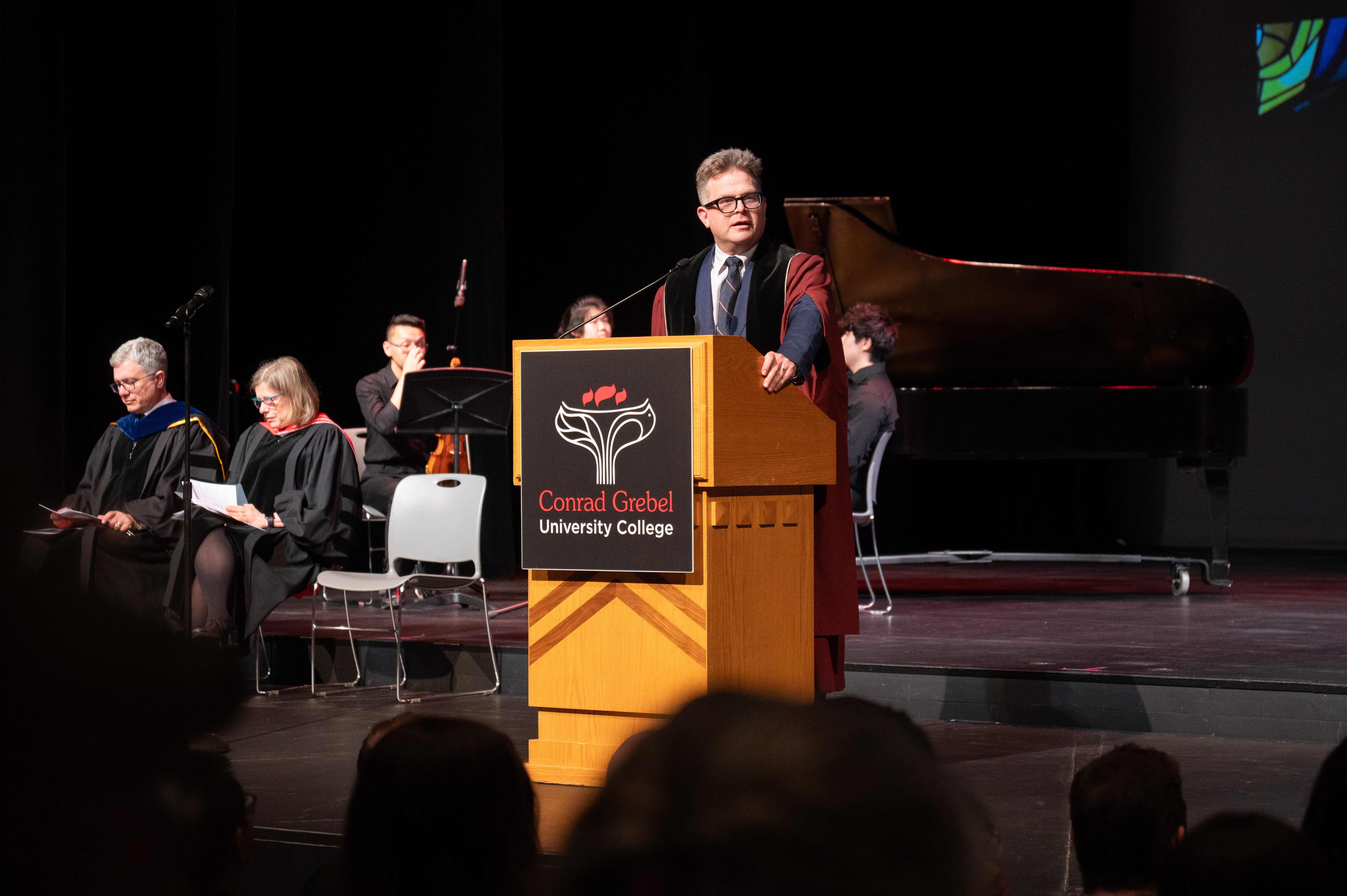 Marcus speaking at Convocation