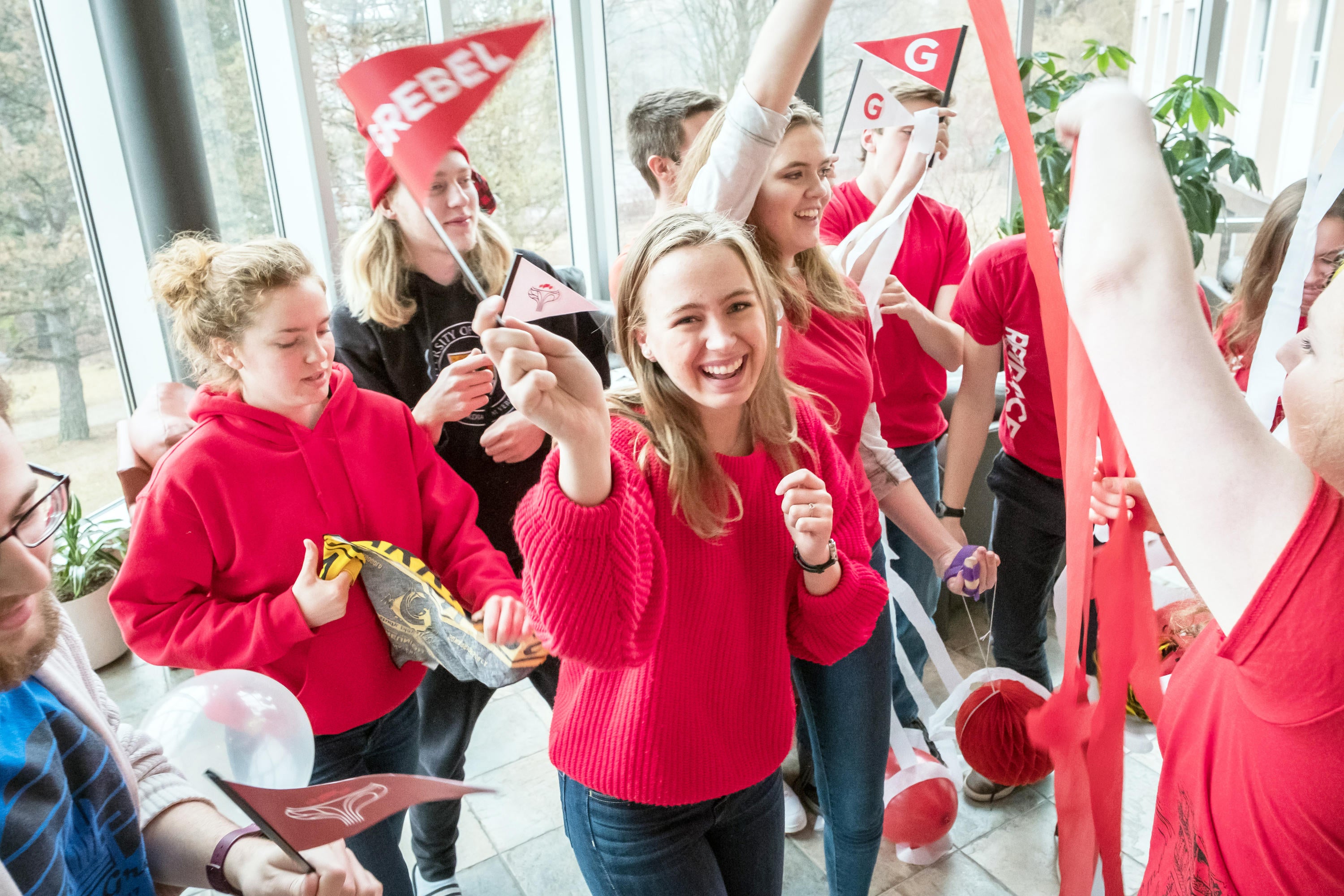 Grebel Students all waring red. Dancing and having fun while showing Grebel pride! 