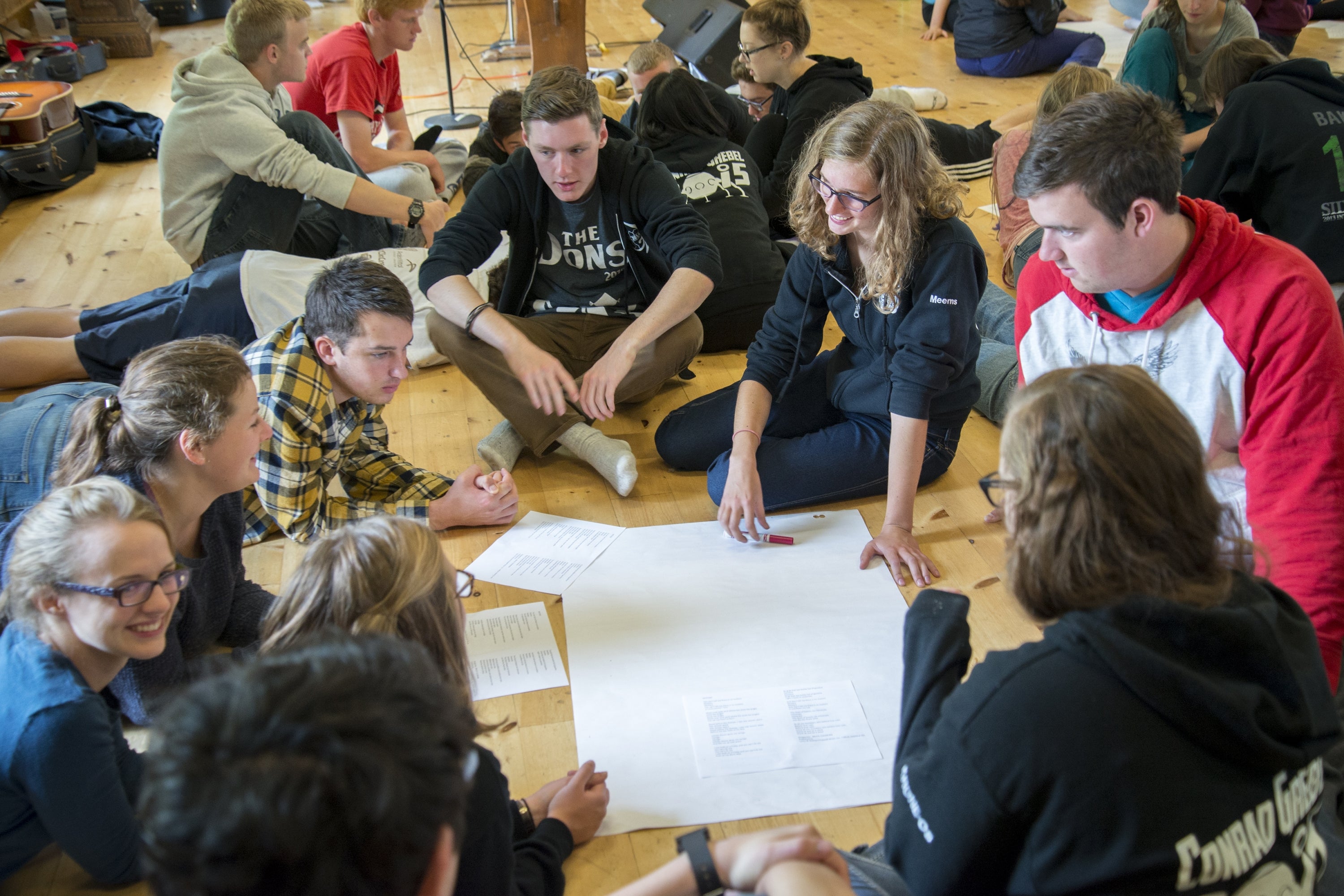 students sitting in a circle during orientaton week