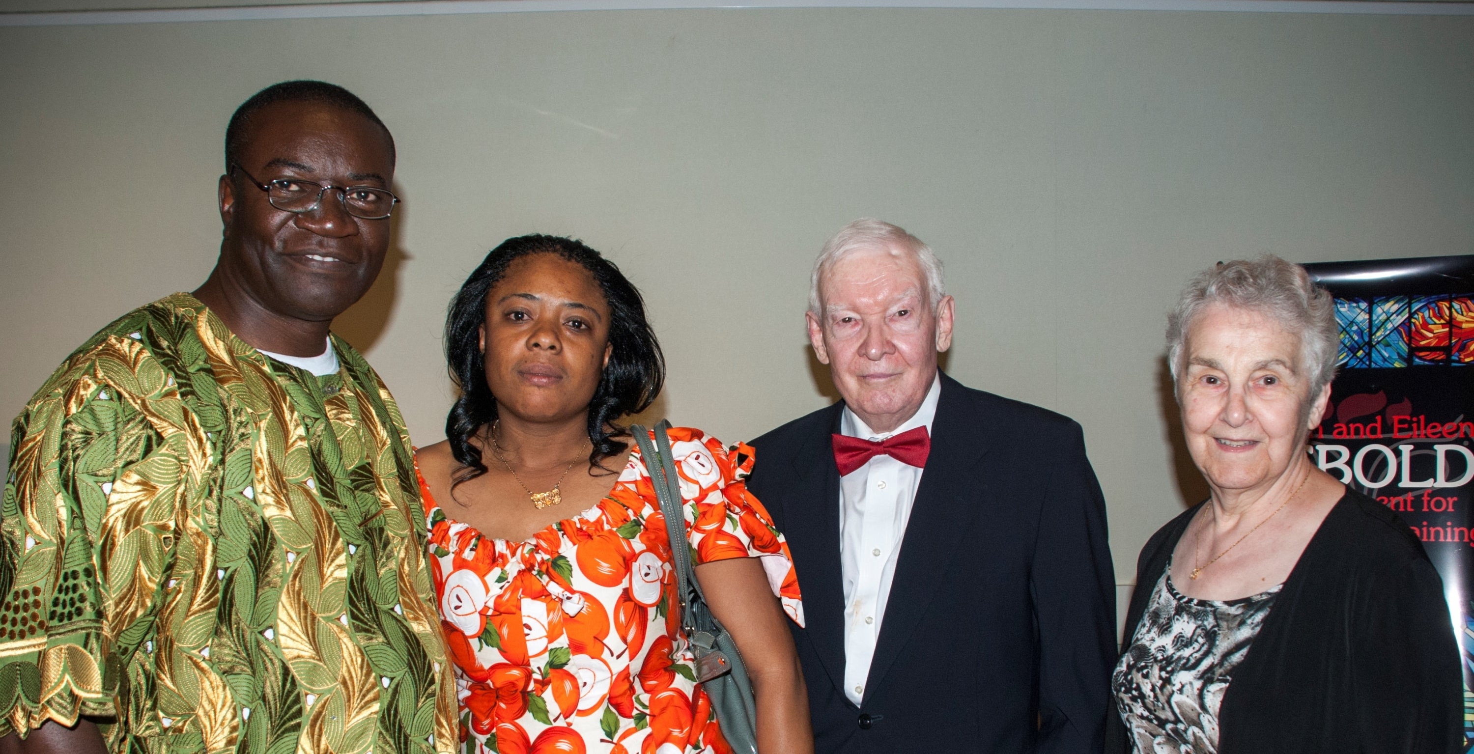 2014 Lebold Banquet speaker Roberson Mbayamvula stands  with his wife, Caris Bango, as well as Ralph and Eileen Lebold.