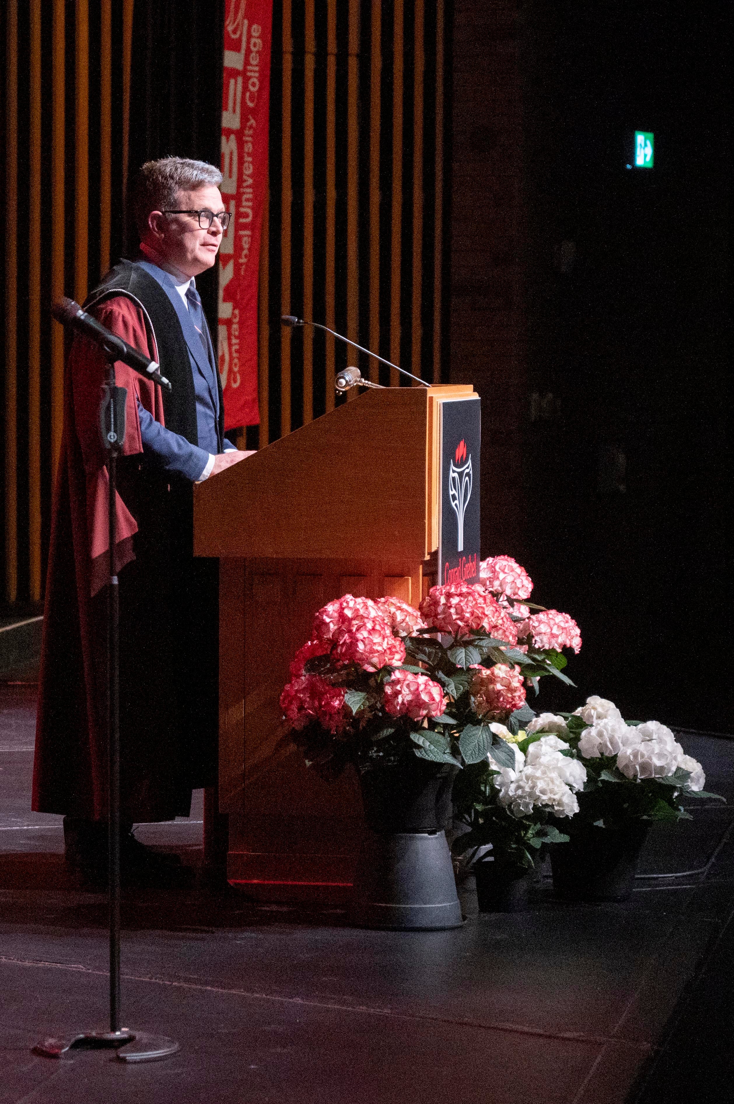Marcus Shantz speaking at convocation