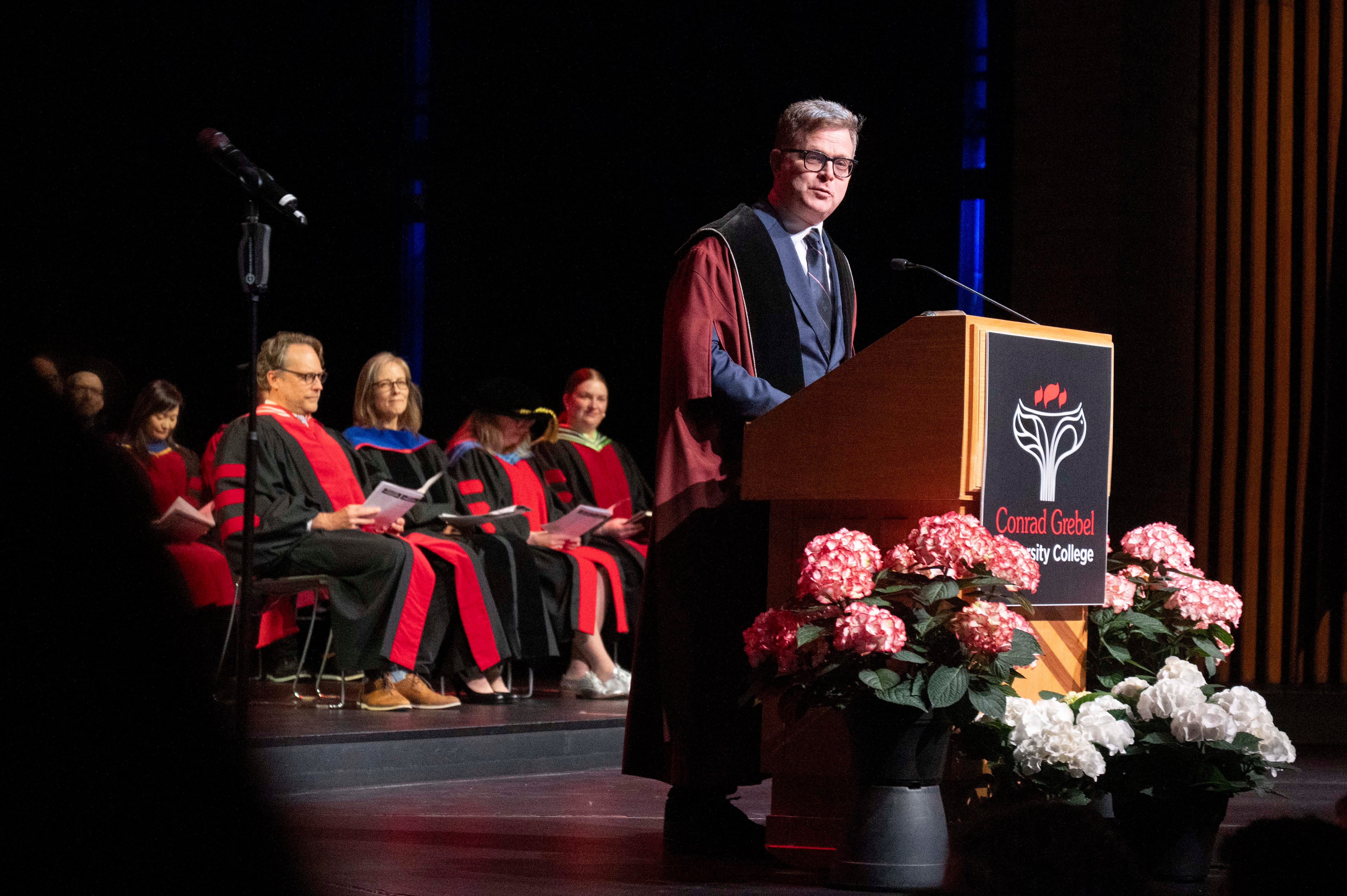 Marcus Shantz speaking at convocation