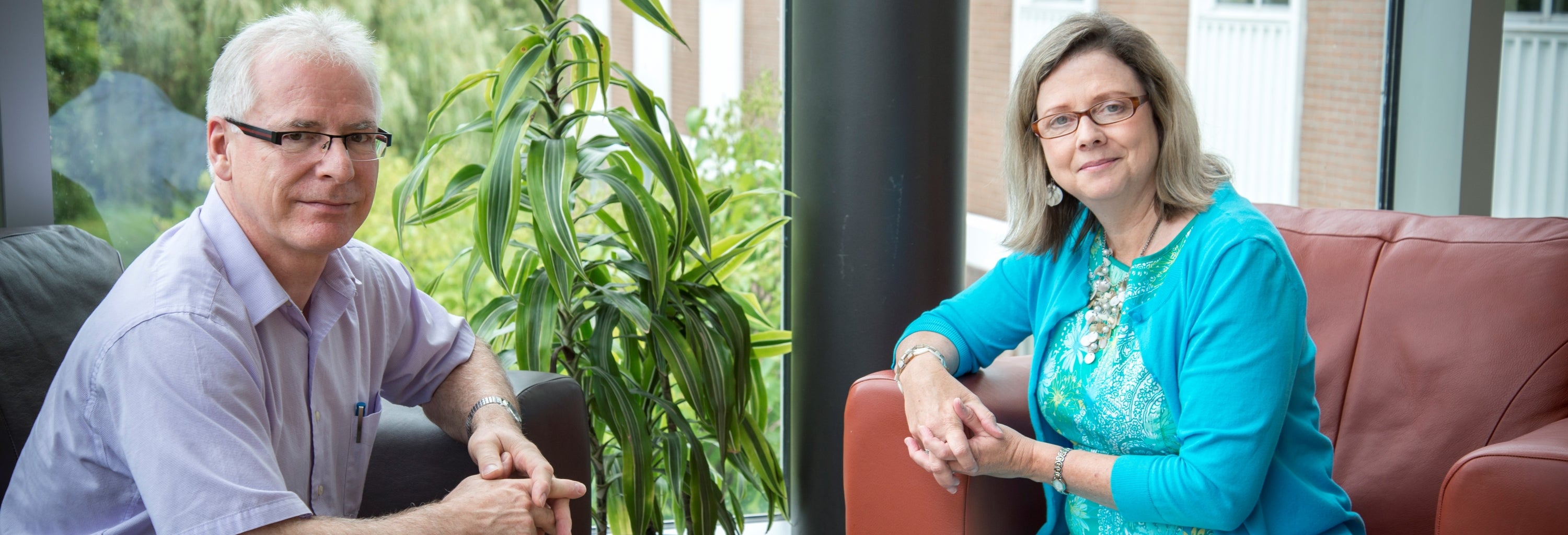    David Martin of Mennonite Church Eastern Canada visits with President Susan Schultz Huxman