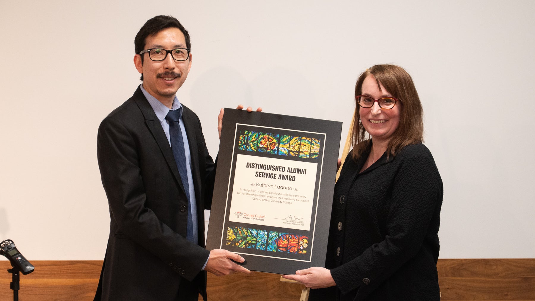 Kathryn Ladano being handed award