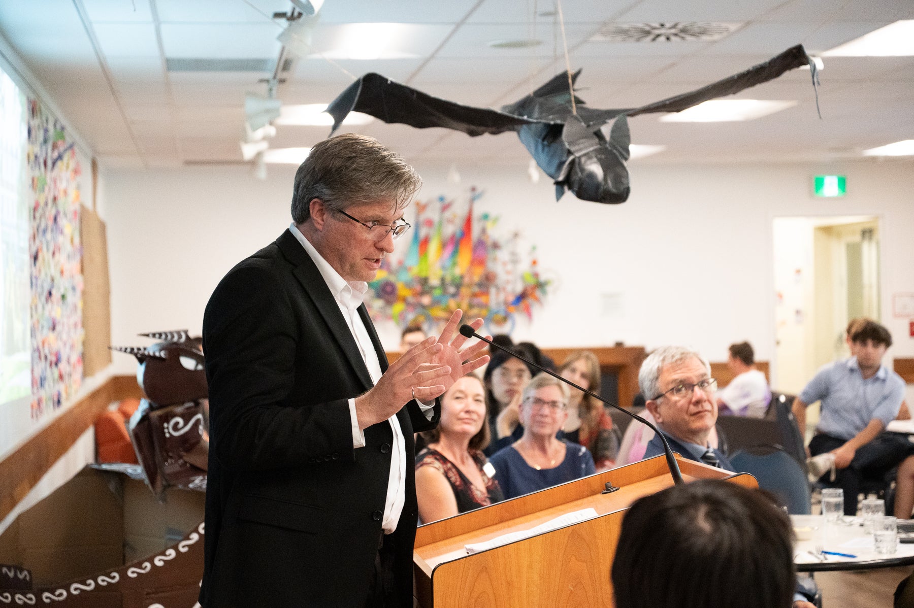 Bill Roseheart gives a speech to celebration attendees at Grebel