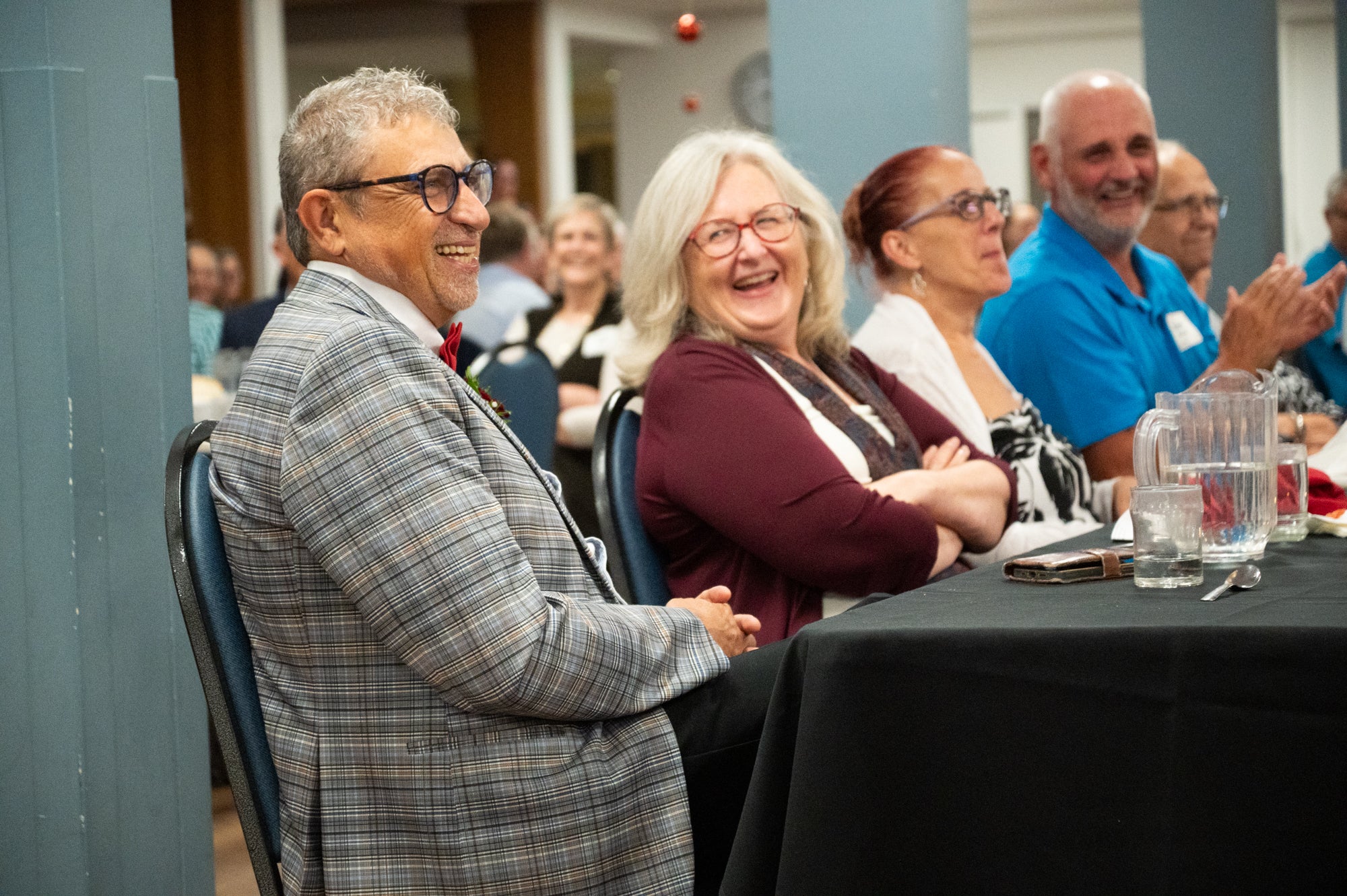 Fred and his wife Wanda laugh at his retirement party