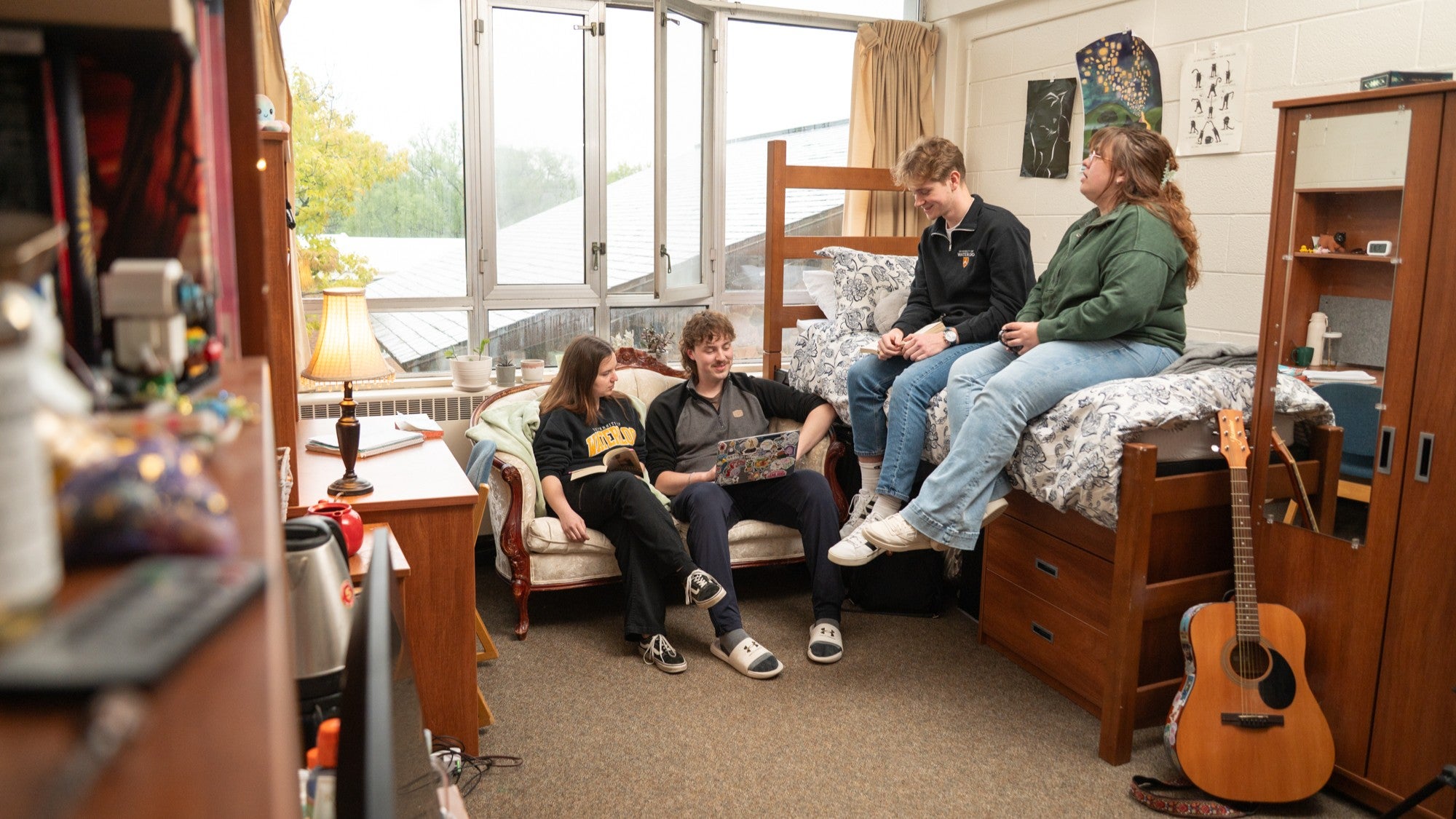 Grou Grebel students hang out in a bright residence room