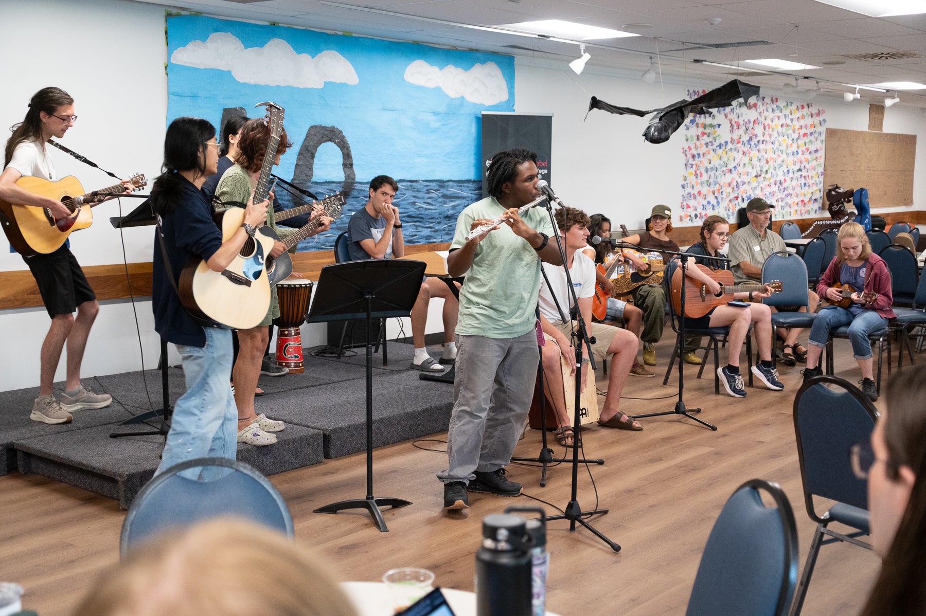 Students sing and play instruments during coffee house