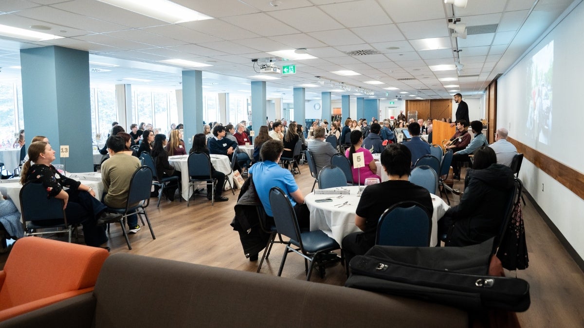 an event with guests sitting at round tables in the grebel dining room