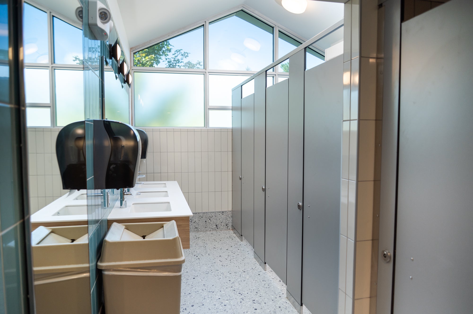 bathroom stalls and sinks