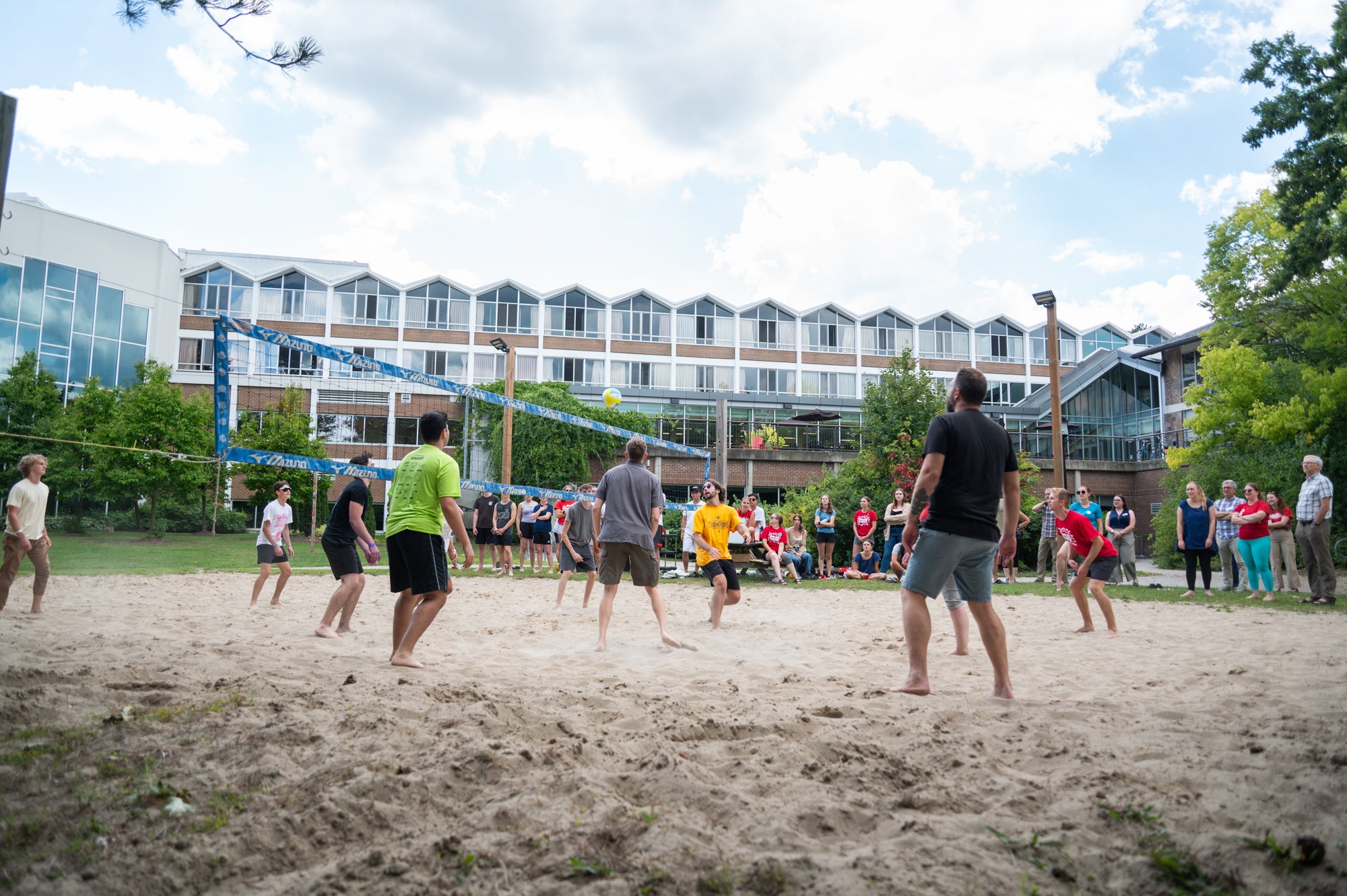 Students play volleyball outside Grebel